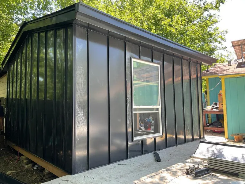 Black standing seam metal wall panels for Roof Inspection in Highgrove