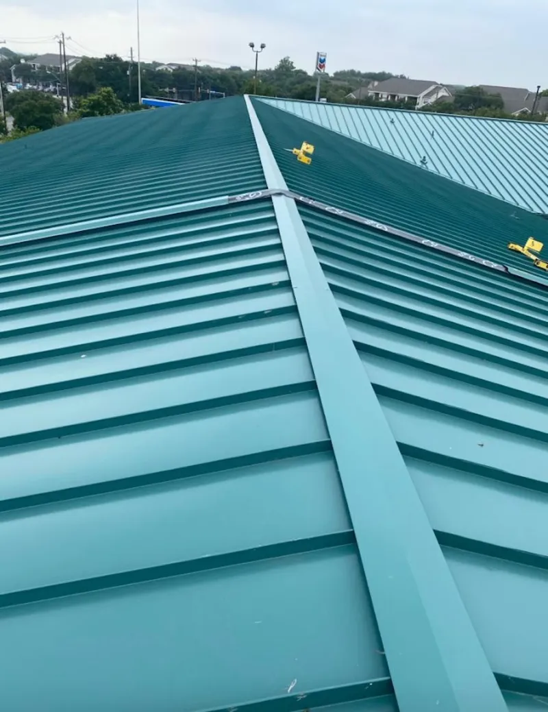 Green commercial metal roof ridge and valley for Metal Roof Repair in Highgrove