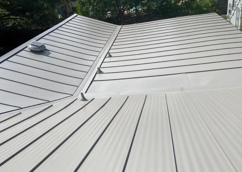 Solar attic fan installed on a metal roof for Roof Ventilation in Highgrove